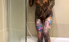 tattooed-beauty-indulges-in-hot-masturbation-in-the-shower