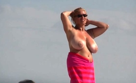 Beach Voyeur Captures Big Boobed Mature Woman Sunbathing